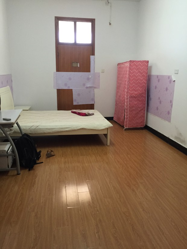 BEFORE: I'm not the girly-est girl in the world so the pink and the purple threw me off a bit, but not as much as the random placement of these wallpaper panels. Haha.