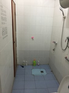 AFTER: Very similar. The school bought me a new shower head (YAY!) and I put up a wall sticker from home.