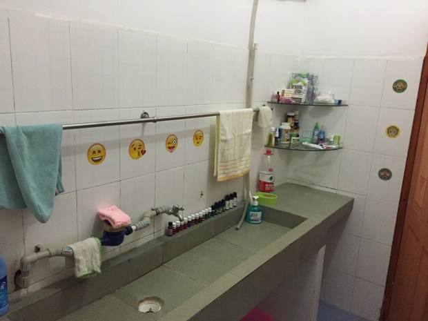 AFTER: My wonderful Emoji wall stickers from Kota make this random sink room a lot more fun. Also, please don't judge my essential oil collection. Once again, I know it may seem crazy that I packed so much, but considering I got sick my very first week and my oils and prayer are the only things that helped me, I think it was worth it. Also, those water bottles are what I am currently using to wash my face. The water here is too polluted and burns my face so face wipes and bottled water are my temporary solution.